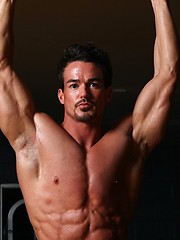 Muscular guy Chris Adams posing