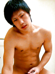 Japanese teen boy stroking own penis