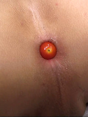 Asian boy putting fresh vegetable into own anal hole