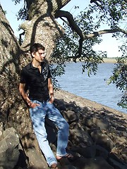 Handsome twink guy posing for the camera outdoors