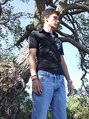 Handsome twink guy posing for the camera outdoors