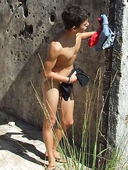 Handsome twink guy posing for the camera outdoors