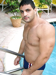Strong stud relaxing in the pool and baring his body