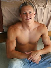 Muscled jock playing with cock