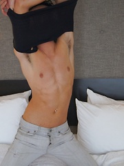 Gorgeous twink Jake Diamante busts a nut onto his abs.