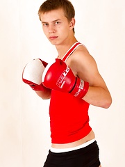 Sporty straight Eugene Small posing in boxing gloves