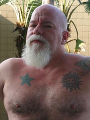 Sexy daddy Noah Post is not shy about showing off his tat, muscles or his furry body